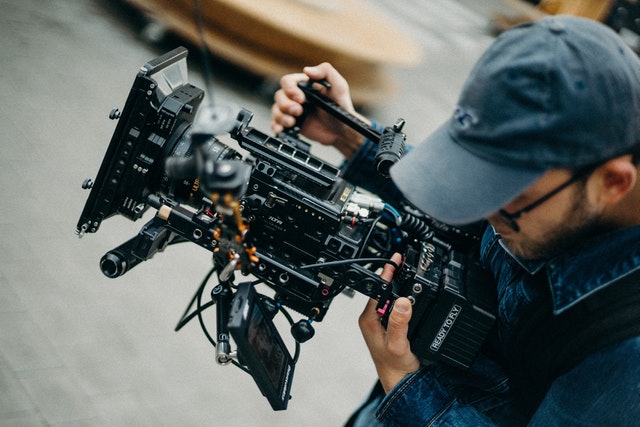 Man handling a video camera